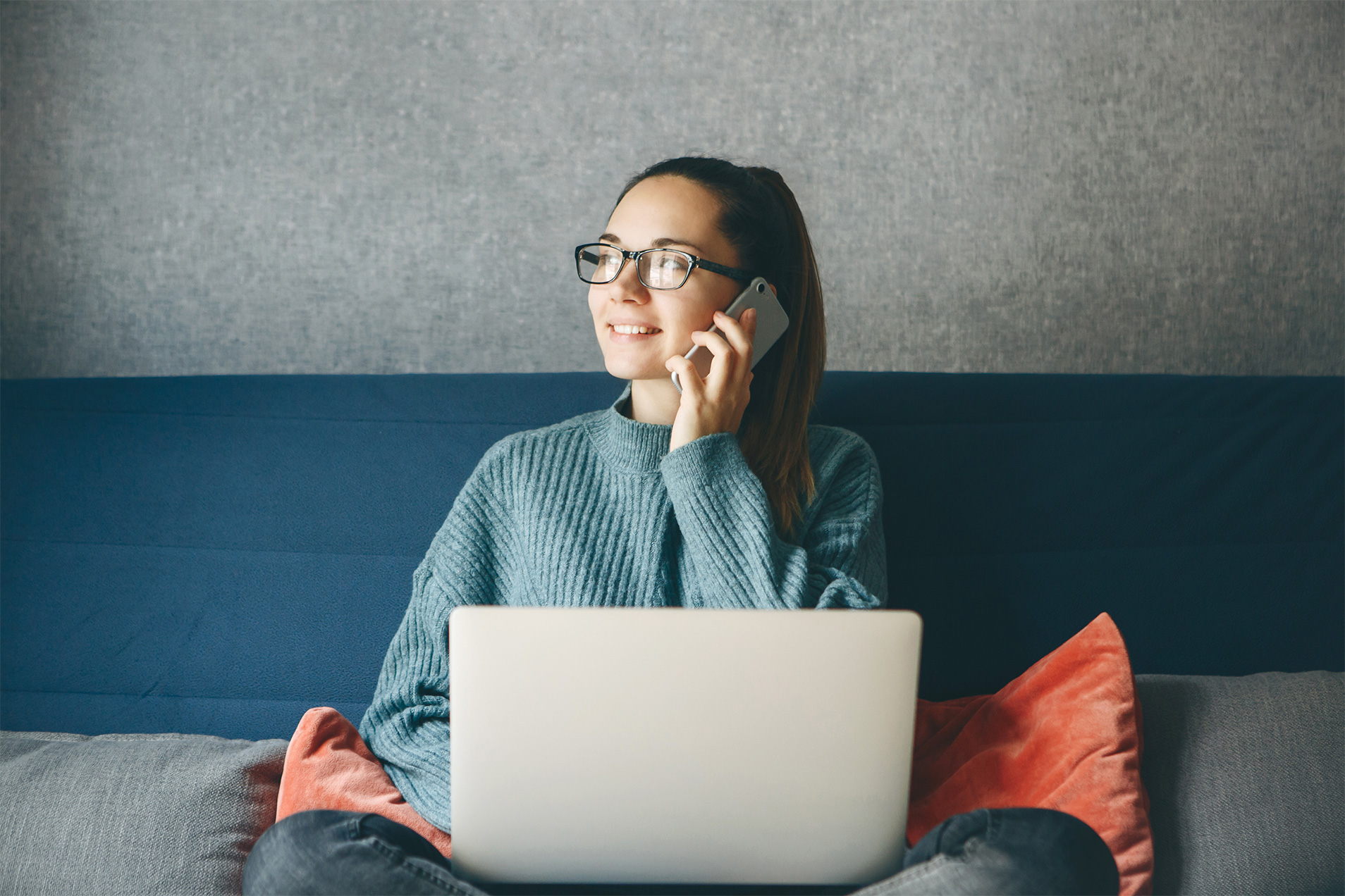 Lady on working on laptop in lounge area